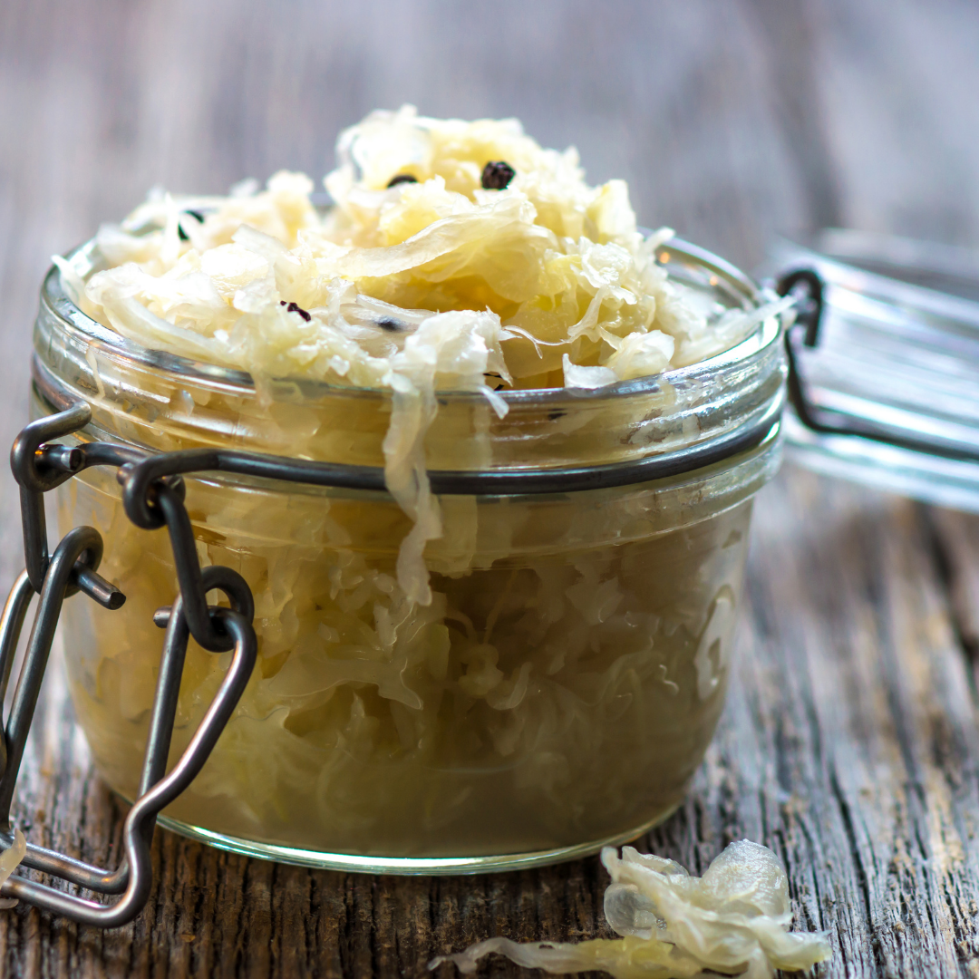 Image of a simple naked sauerkraut in an open clip top jar