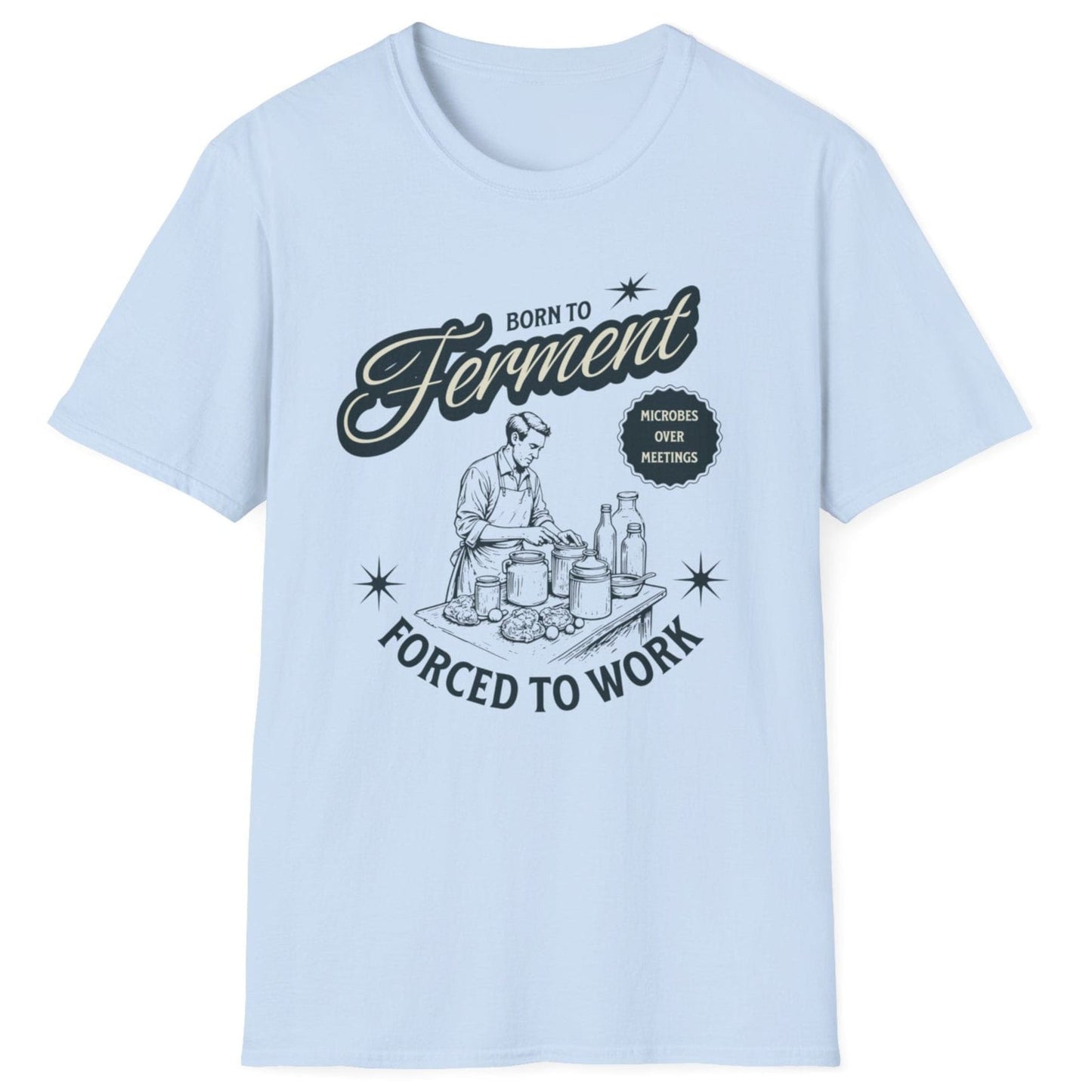 Light blue T-Shirt with a vintage style illustration of a man busy creating ferments in his kitchen with the words Born To ferment, Forced to Work in 50's style typography. Great gift for fermenters.