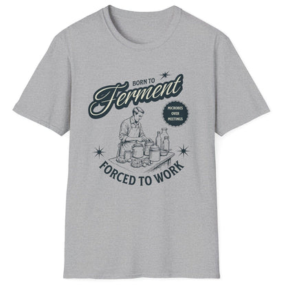 Sports grey T-Shirt with a vintage style illustration of a man busy creating ferments in his kitchen with the words Born To ferment, Forced to Work in 50's style typography. Great gift for fermenters.