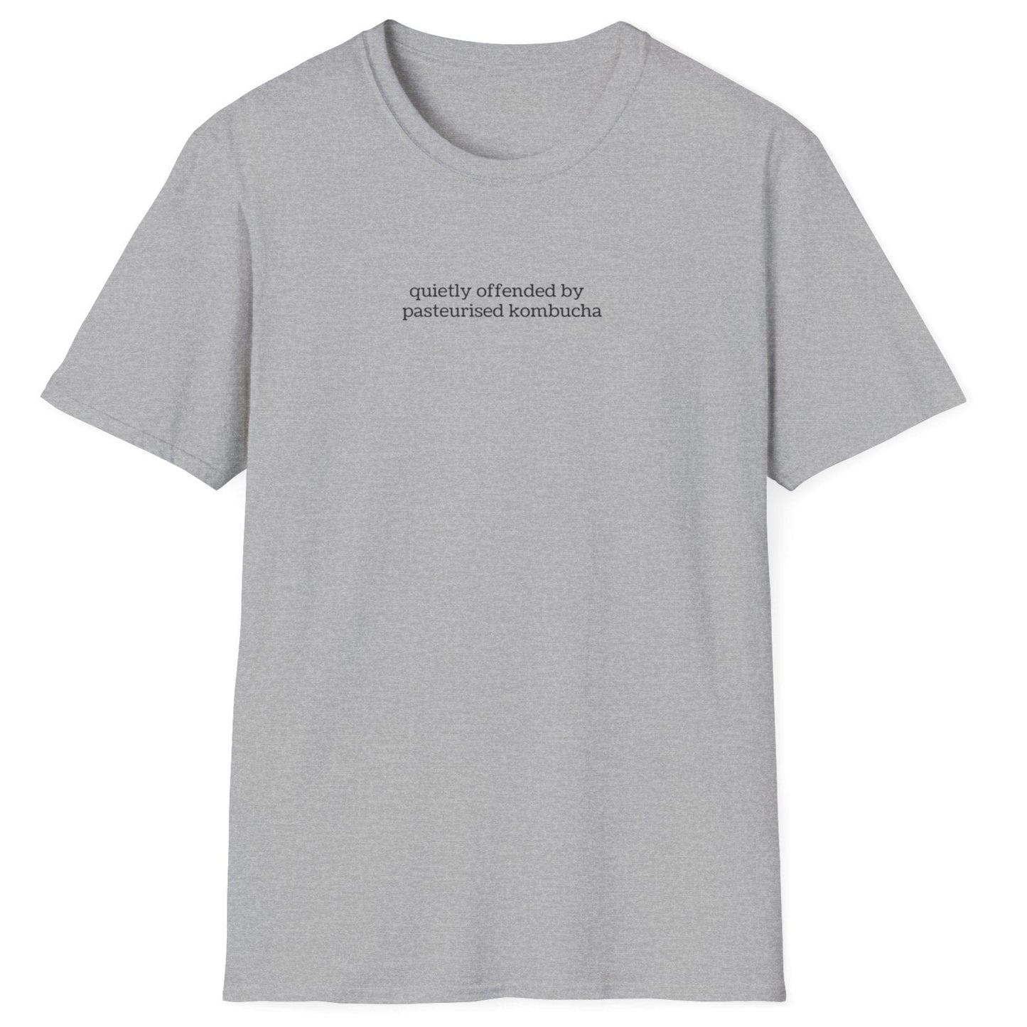 Minimalist grey t-shirt with small lowercase black text reading “quietly offended by pasteurised kombucha” — designed for kombucha purists and low-key fermentation fans