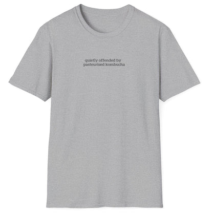 Minimalist grey t-shirt with small lowercase black text reading “quietly offended by pasteurised kombucha” — designed for kombucha purists and low-key fermentation fans