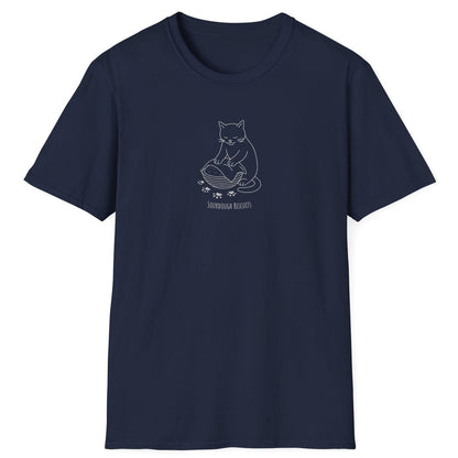 Illustrated cat kneading dough in a banneton, surrounded by floury paw prints — Sourdough Biscuits t-shirt in navy for cat and bread lovers
