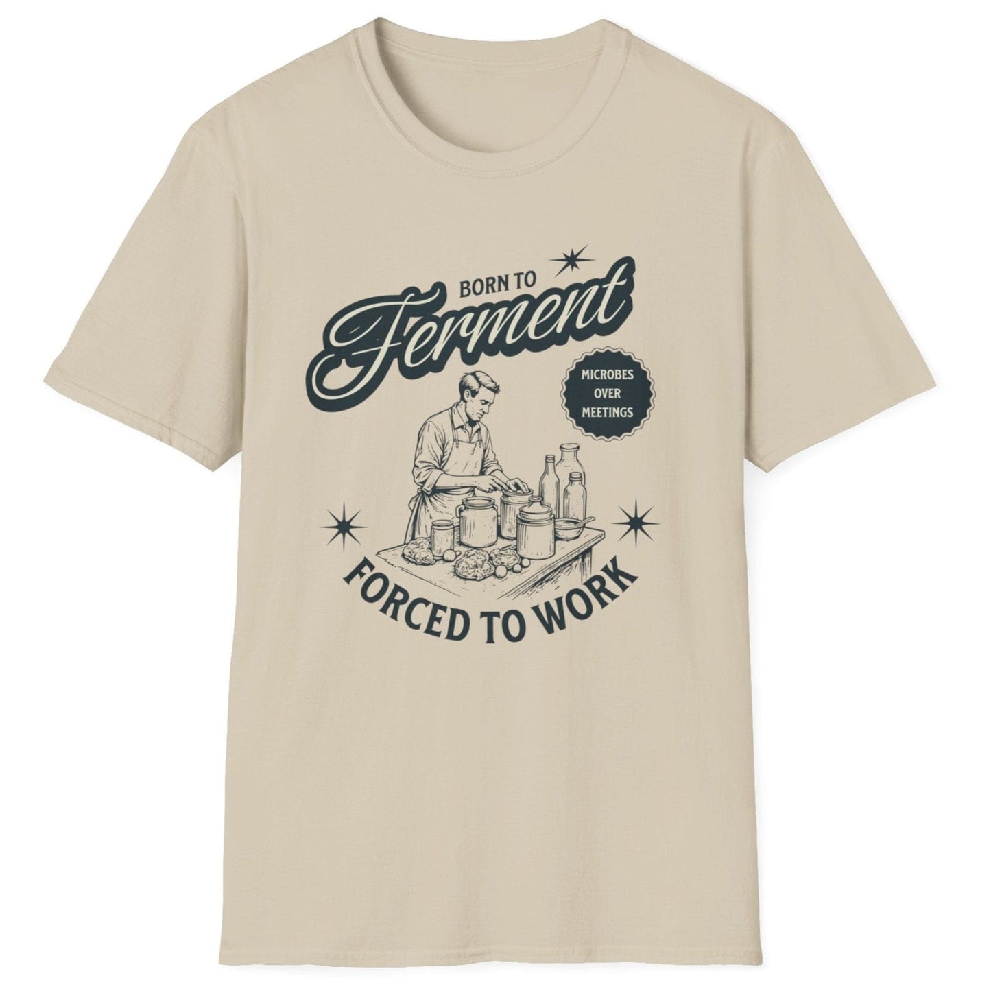 Sand coloured T-Shirt with a vintage style illustration of a man busy creating ferments in his kitchen with the words Born To ferment, Forced to Work in 50's style typography. Great gift for fermenters.