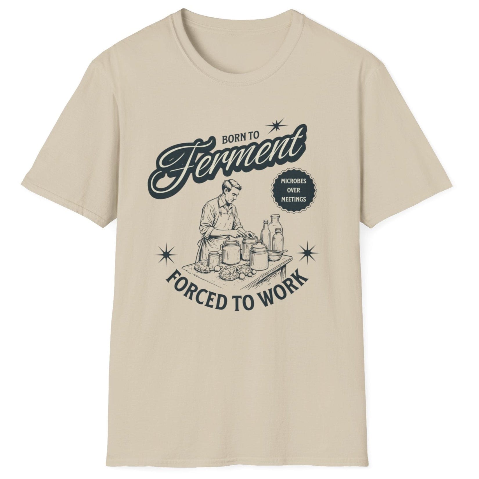 Sand coloured T-Shirt with a vintage style illustration of a man busy creating ferments in his kitchen with the words Born To ferment, Forced to Work in 50's style typography. Great gift for fermenters.