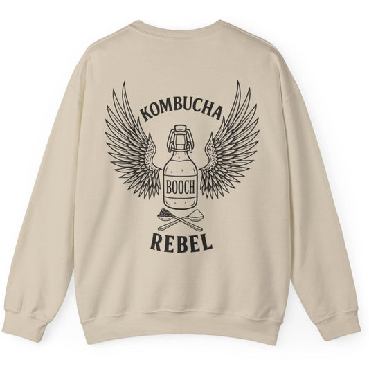 Sand Kombucha Rebel back print sweatshirt for fans of fermentation, featuring a bottle of booch with dramatic wings and crossed spoons - one with tea leaves and one with sugar. Design inspired by vintage Harley Davidson jackets.