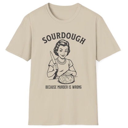 Retro-style sourdough T-shirt in sand featuring a 1950s woman slicing bread with the slogan ‘Sourdough Because Murder Is Wrong’ – dark humour for bread lovers